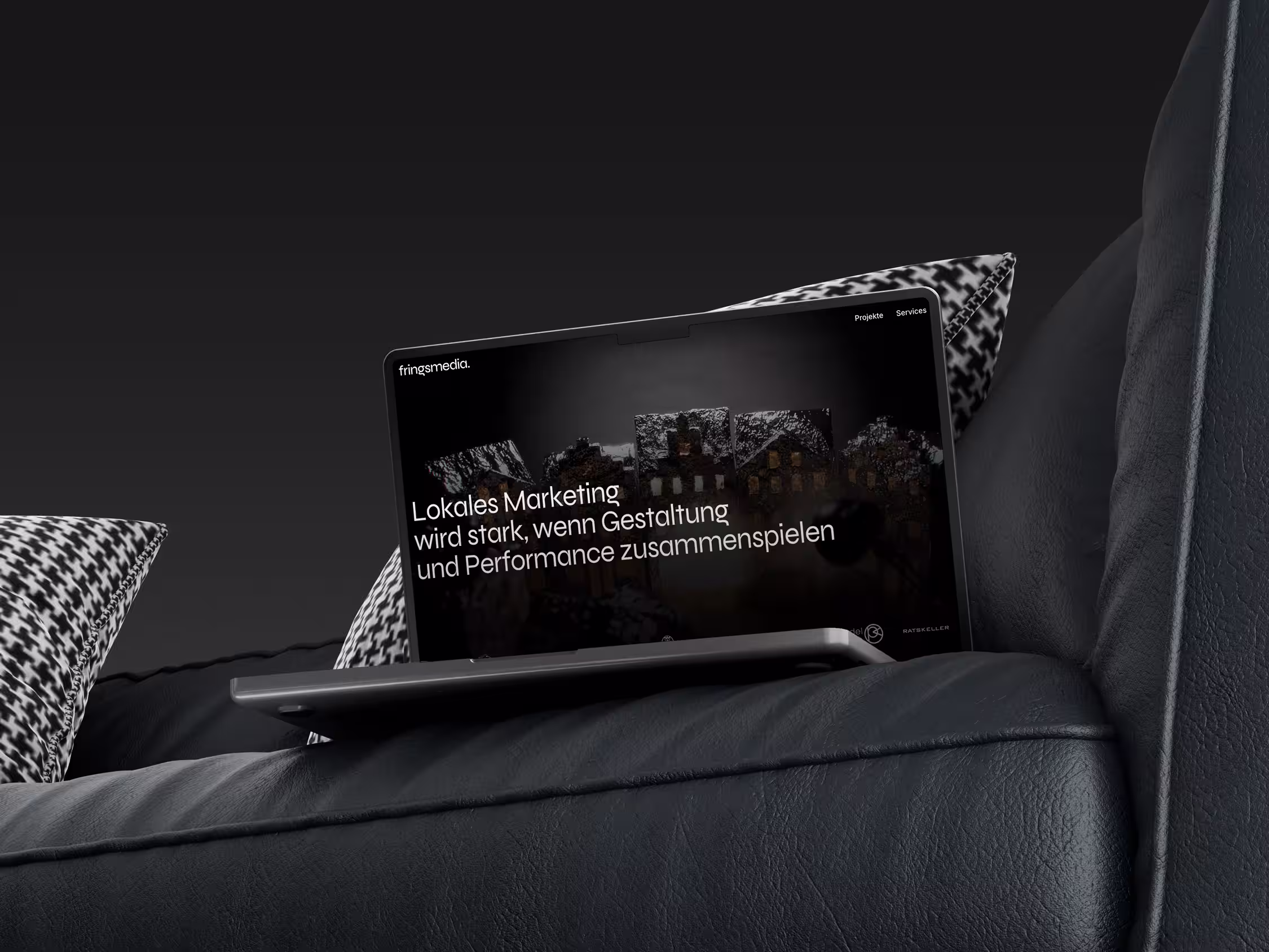 Frings Media, dargestellt in einem Laptop-Mockup